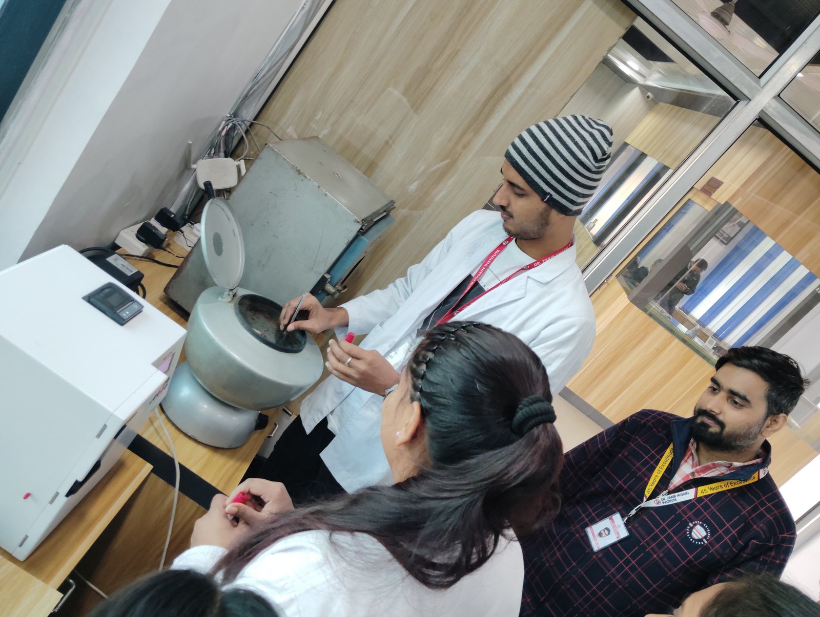 Students using Centrifuge Machine